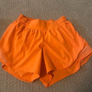 Lululemon low rise 4 inch inseam highlight orange hotty hot shorts